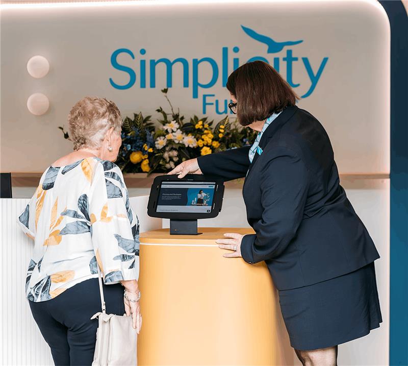 Simplicity Funeral director assisting a woman