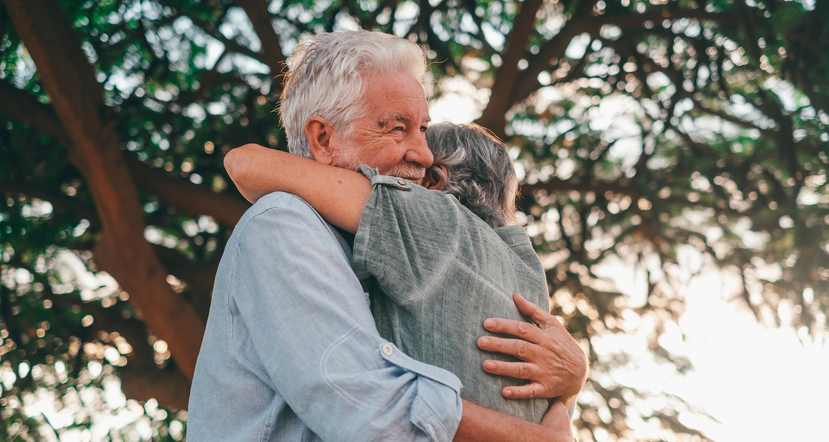 A man hugging a woman