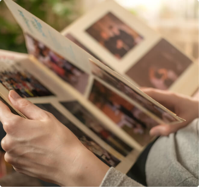 people looking through photo albums